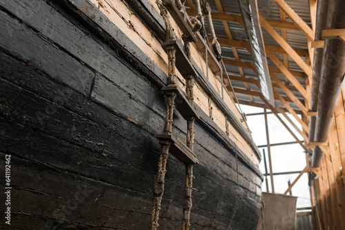 board of an old wooden ship with a ladder in the museum