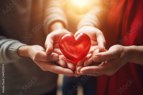 Family holding red heart on hands  health theme or world health day.generative ai 