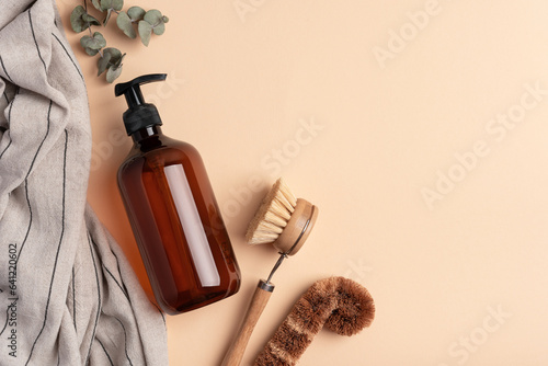 Eco wooden dish brush and dispenser bottle photo