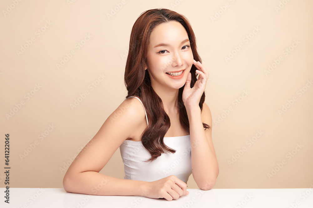 Beautiful young asian woman with clean fresh skin on beige background, Face care, Facial treatment, Cosmetology, beauty and spa, Asian women portrait. Beautiful young asian woman with clean fresh skin on beige background, Face care, Facial treatment, Cosmetology, beauty and spa, Asian women portrait.