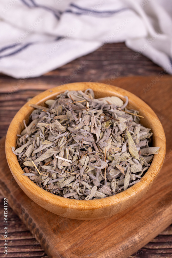 Dry Sage leaves. Dried salvia or sage leaves in wood bowl. herbal medicine Dry Sage leaves. Dried salvia or sage leaves in wood bowl. herbal medicine