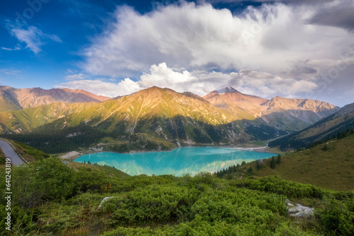 Big Almaty Lake in Tien Shan mountains of Kazakhstan. Panorama of Beautiful mountain landscape on a summer evening