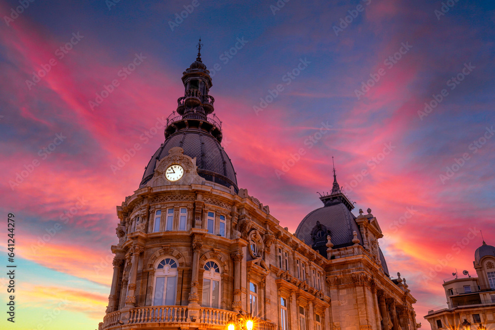 Detail of the Town Hall of Cartagena, Region of Murcia, Spain, with a stunning pink sky at sunset