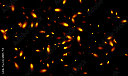 Abstract red fire sparks on black background.