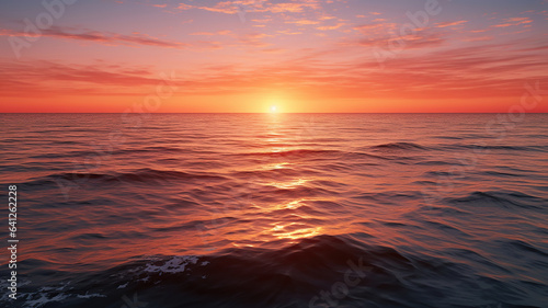 The breathtaking colors of the sun rising or setting over the ocean horizon