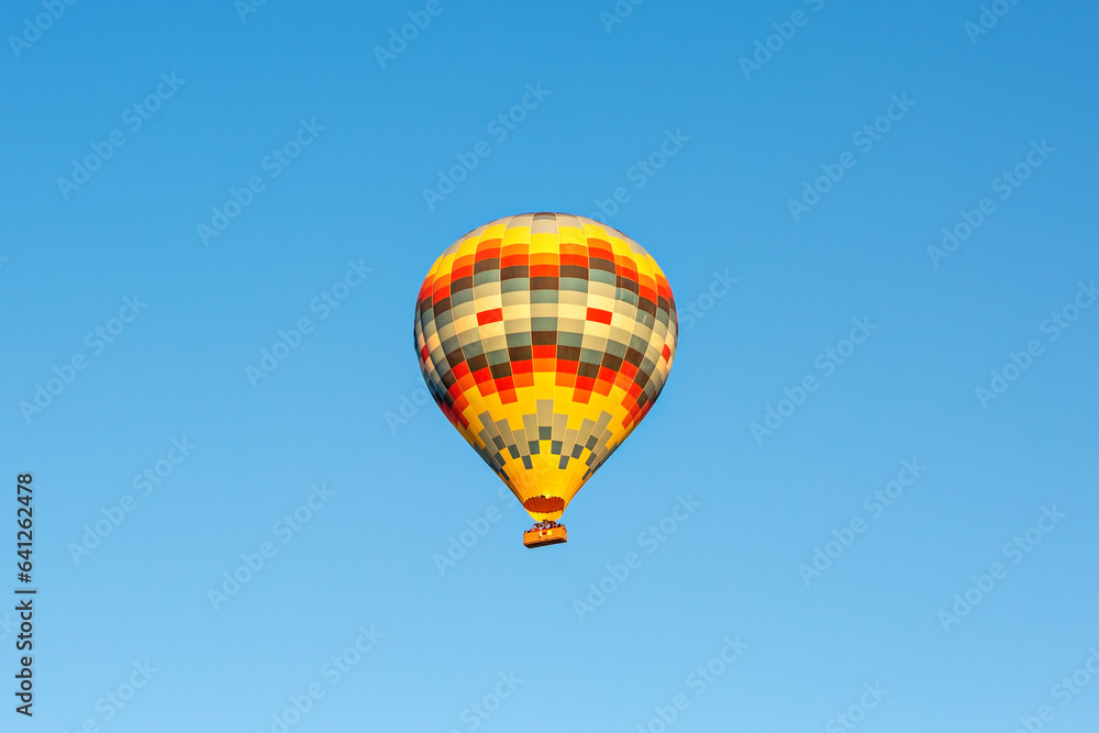 Hot air balloon in the blue sky. Cappadocia, Turkey
