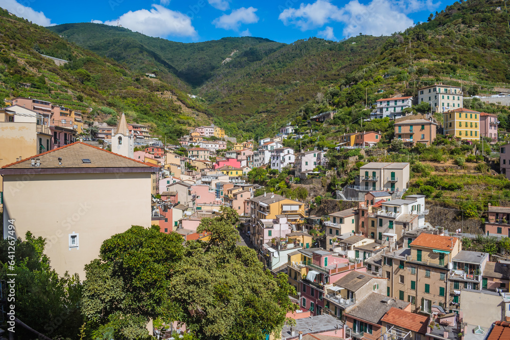 Colorful architecture of Riomaggiore village in valley, Cinque Terre ITALY