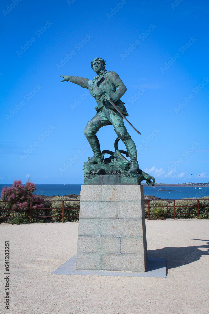 Statue of Surcouf located on the promenade of the ramparts in Saint-Malo in France - obrazy, fototapety, plakaty 