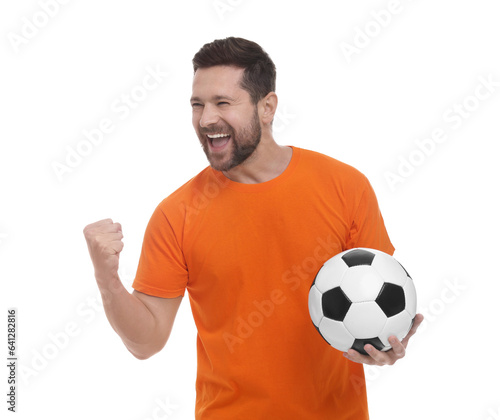 Emotional sports fan with ball celebrating on white background