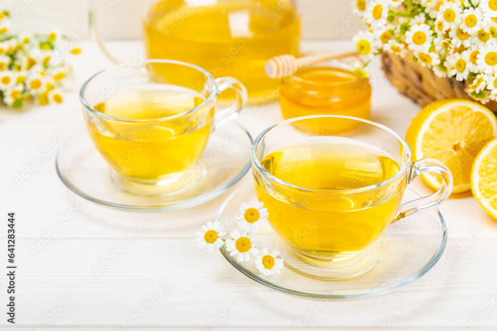 Herbal tea with fresh chamomile flowers on textured background. Calming and relaxing drink. Immunity.Cup of hot chamomile tea. Tea drinking concept. Tea ceremony. Place for text, copy space. Herbal tea with fresh chamomile flowers on textured background. Calming and relaxing drink. Immunity.Cup of hot chamomile tea. Tea drinking concept. Tea ceremony. Place for text, copy space.