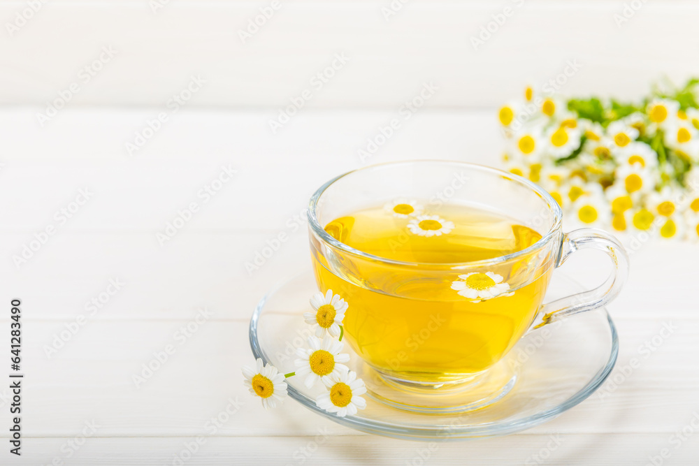 Herbal tea with fresh chamomile flowers on textured background. Calming and relaxing drink. Immunity.Cup of hot chamomile tea. Tea drinking concept. Tea ceremony. Place for text, copy space. Herbal tea with fresh chamomile flowers on textured background. Calming and relaxing drink. Immunity.Cup of hot chamomile tea. Tea drinking concept. Tea ceremony. Place for text, copy space.