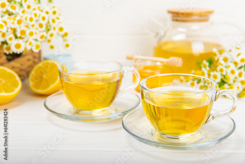 Herbal tea with fresh chamomile flowers on textured background. Calming and relaxing drink. Immunity.Cup of hot chamomile tea. Tea drinking concept. Tea ceremony. Place for text, copy space.