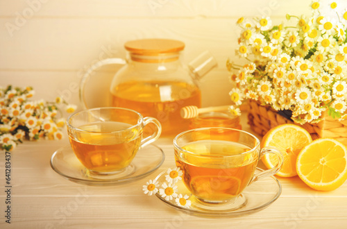 Herbal tea with fresh chamomile flowers on textured background. Calming and relaxing drink. Immunity.Cup of hot chamomile tea. Tea drinking concept. Tea ceremony. Place for text, copy space.