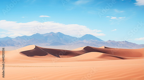 Pristine desert landscape with sand dunes and distant mountains