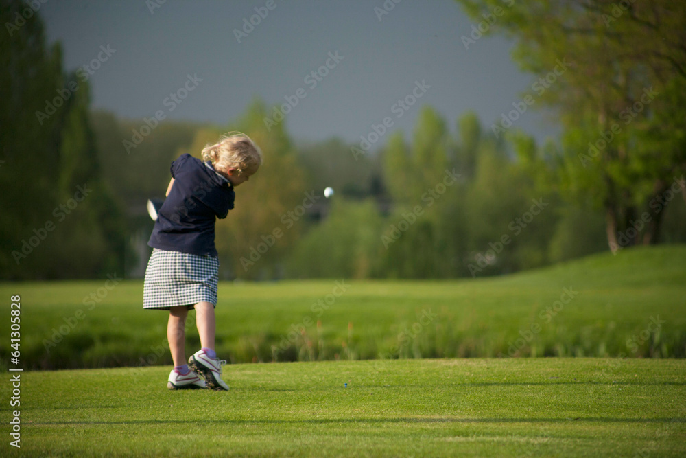 Golf drive with flyign ball on golf course. Golf drive with flyign ball on golf course.