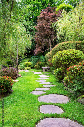 Photography Stone stepping Walkway among lawn in a Japanese style garden.
