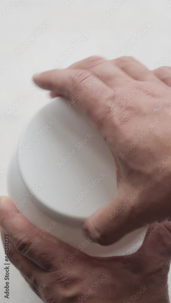 Male hands open a plastic jar of protein powder and scoop up a full measuring spoon with whey chocolate protein powder, process of making protein drink, sport nutrition, vertical video Male hands open a plastic jar of protein powder and scoop up a full measuring spoon with whey chocolate protein powder, process of making protein drink, sport nutrition, vertical video