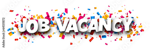 Job vacancy sign with colorful cut out ribbon confetti background.