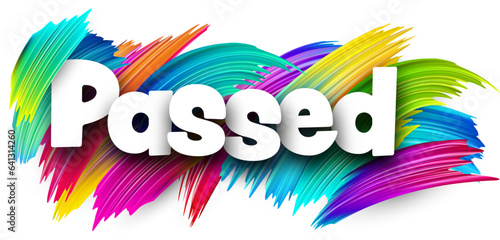 Passed paper word sign with colorful spectrum paint brush strokes over white.