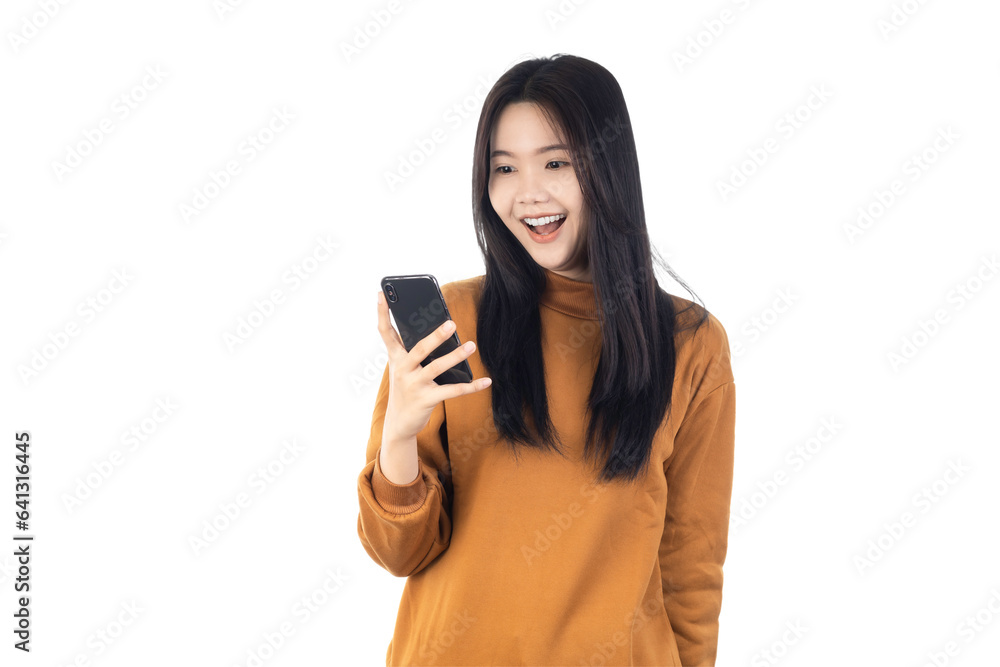 Portrait of a smiling casual Asian woman holding smartphone isolated on white background with clipping path. Portrait of a smiling casual Asian woman holding smartphone isolated on white background with clipping path.