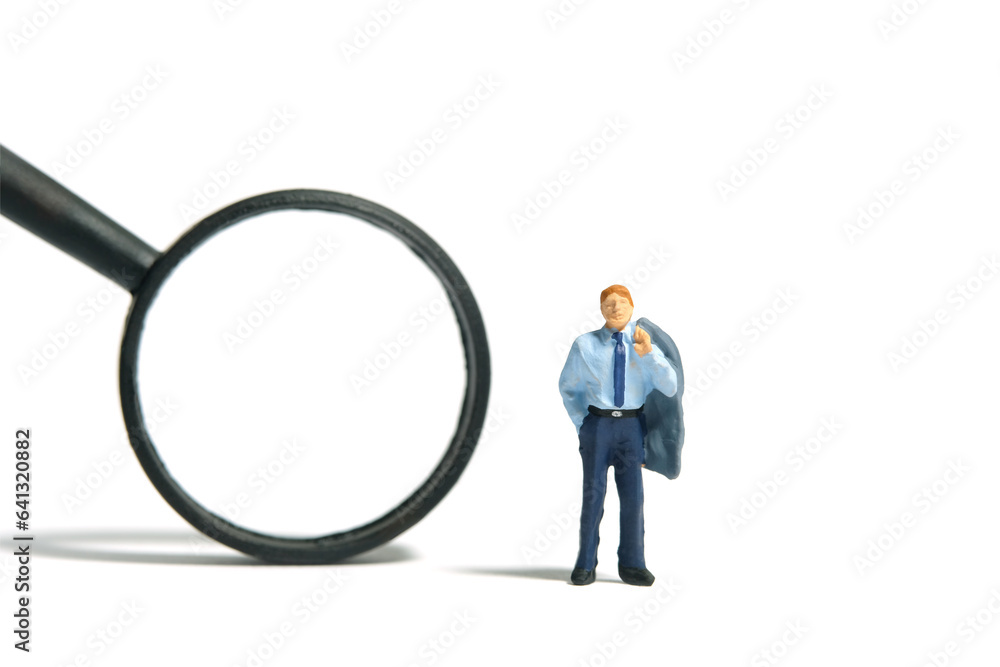 Miniature tiny people toy figure photography. A businessman standing beside black magnifier glass. Isolated on white background Miniature tiny people toy figure photography. A businessman standing beside black magnifier glass. Isolated on white background