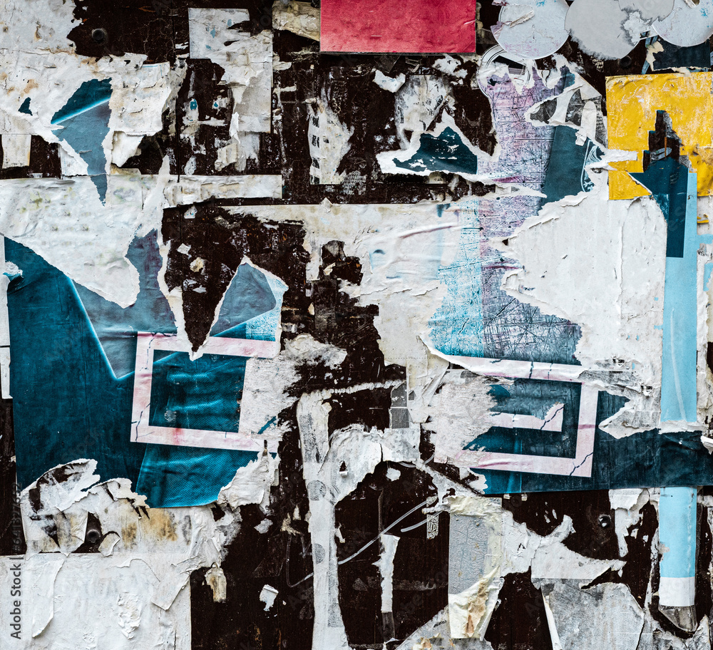 Fototapeta premium Torn Ripped Aged Colorful Paper Posters. Urban Street Gray Wall Surface. Grunge Rough Dirty Background. Distress Texture for Mixed Media Collage. 