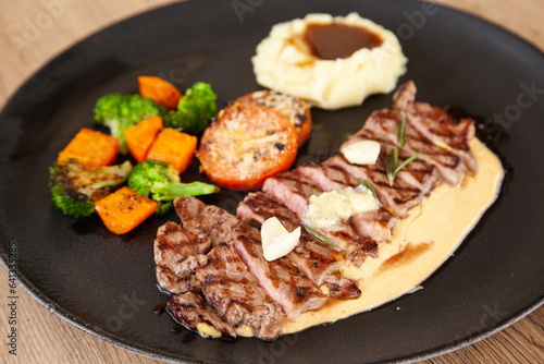 Striploin angus steak with mashed potato and grilled vegetable