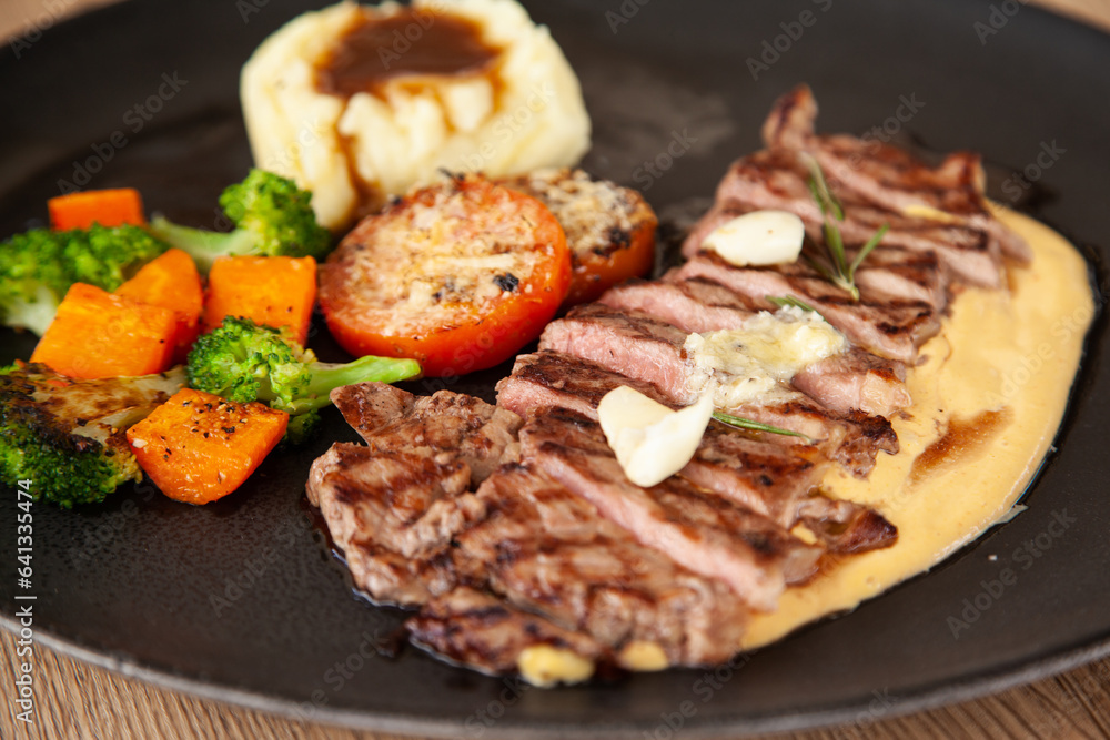 Striploin angus steak with mashed potato and grilled vegetable Striploin angus steak with mashed potato and grilled vegetable