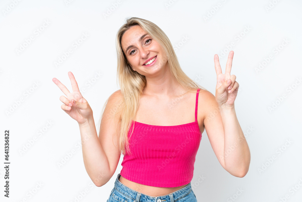 Young caucasian woman isolated on white background showing victory sign with both hands Young caucasian woman isolated on white background showing victory sign with both hands