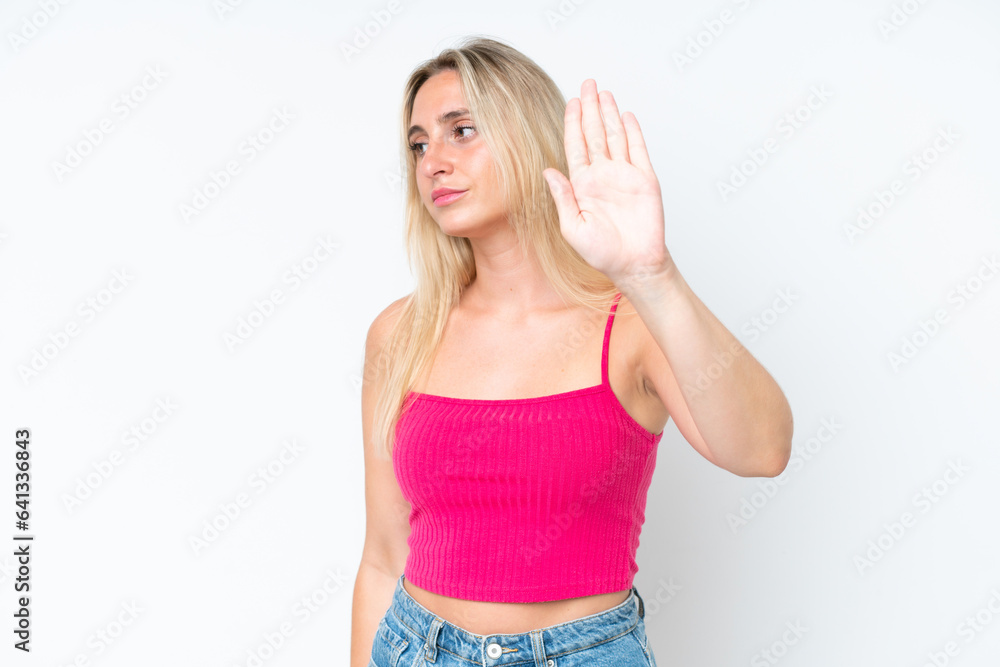 Young caucasian woman isolated on white background making stop gesture and disappointed Young caucasian woman isolated on white background making stop gesture and disappointed