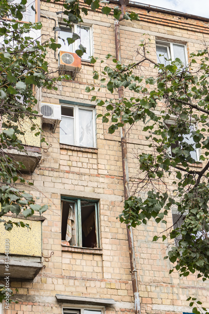 Missile attack in Kyiv, Ukraine, august 2023. Broken windows after explosion. House damaged by blast wave. War in Ukraine. Russian aggression against civil people. Destroyed facade. War danger.