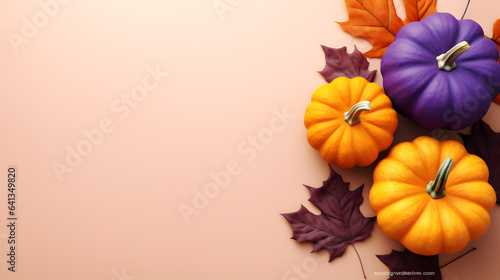 Autumn halloween composition with pumpkins and leaves on pink background. Flat lay, top view, copy space