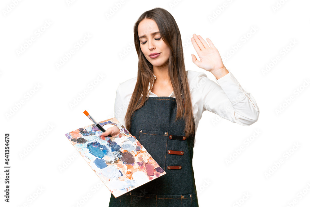 Young artist woman holding a palette over isolated chroma key background making stop gesture and disappointed Young artist woman holding a palette over isolated chroma key background making stop gesture and disappointed