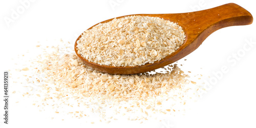 Fotografía Raw oat bran in the wooden spoon, isolated on white background.