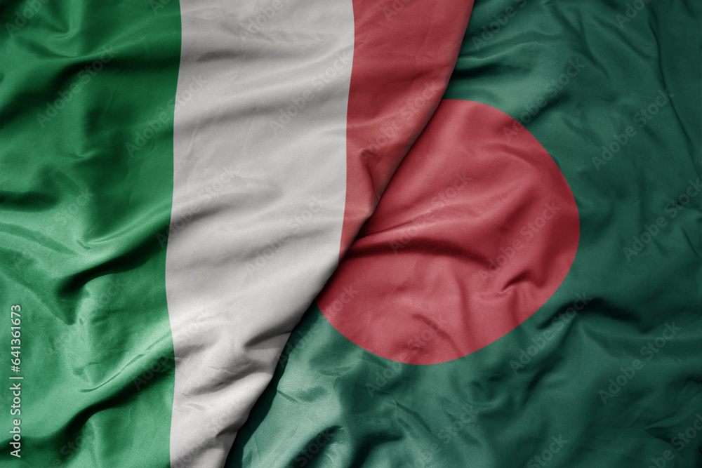 big waving national colorful flag of italy and national flag of bangladesh .