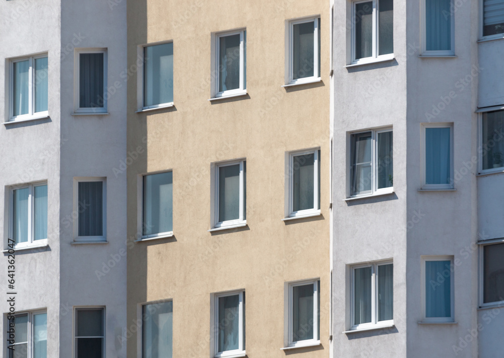Windows and walls in a multi-storey building. Background