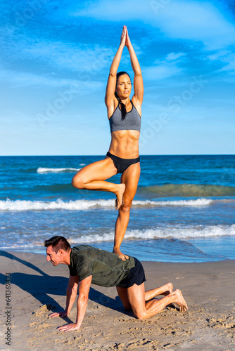 Couple working out at the beach