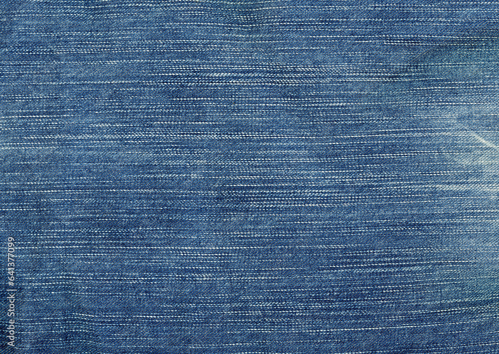 Blue denim fabric background material. Blue denim fabric background material.
