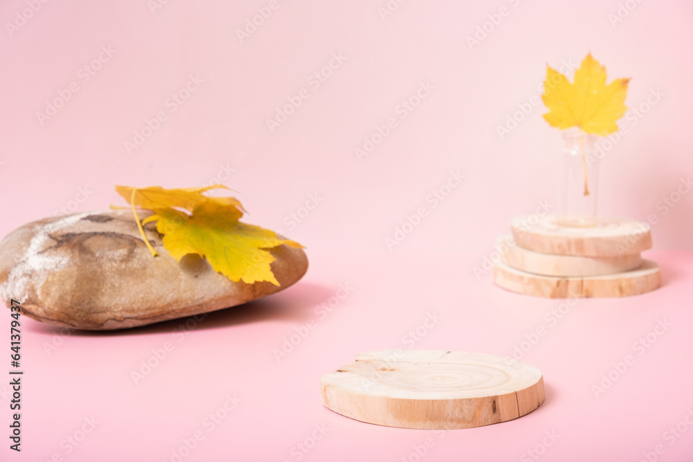 Podium or pedestal template mock up. Autumn scene composition for cosmetics Podium or pedestal template mock up. Autumn scene composition for cosmetics
