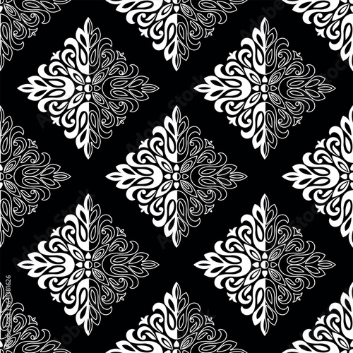 Wallpaper in the style of Baroque. Seamless vector background. White and black floral ornament. Graphic pattern for fabric, wallpaper, packaging. Ornate Damask flower ornament
