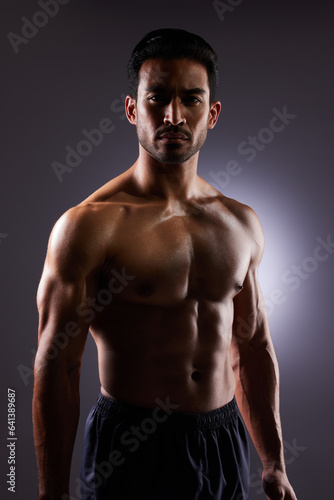 Topless, muscle and portrait of Asian man in dark background for fitness inspiration, beauty aesthetic or healthy body. Shadow aesthetic, male sports model or muscular body builder in studio lighting
