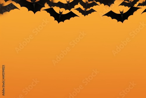 Halloween holiday concept - black bats on orange background, top view, copy space.