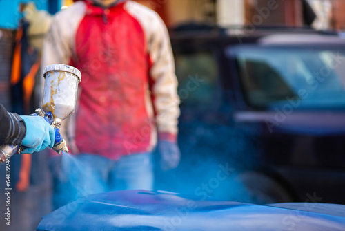 painting the elements of the car body in blue.