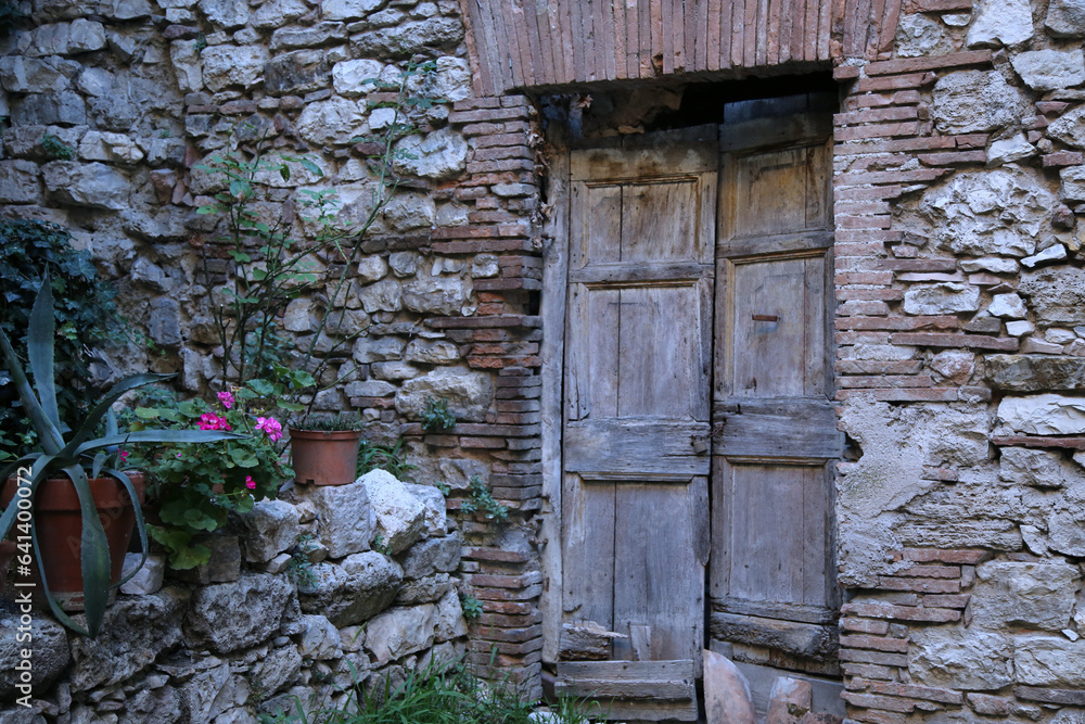 Old door of a palace in the medieval city of Narni
