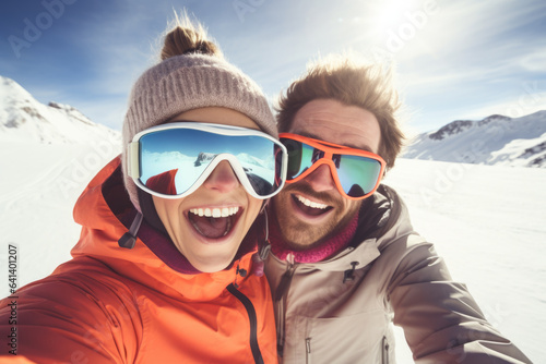 Happy young couple with sunglasses and ski equipment in ski resort Matterhorn, having fun and taking selfie, winter holiday concept