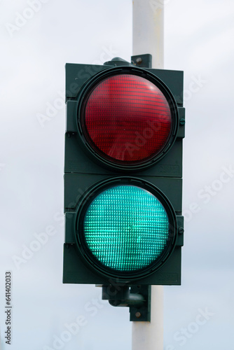 Traffic light with barrier gate work. Traffic lights with two colors on, red and green. Italy, Europe.
