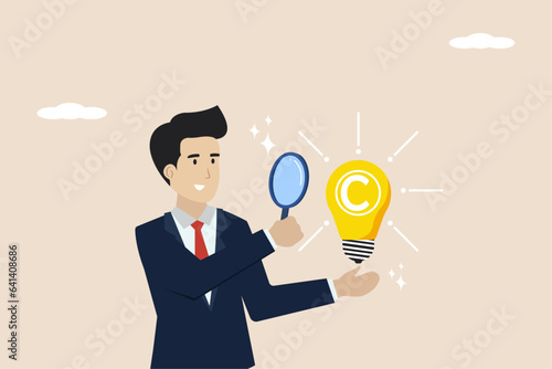 Copyright protected by law, trademark intellectual property protection, original idea,legal protection registered concept, businessman looking at copyright symbol light bulb idea with magnifying glass