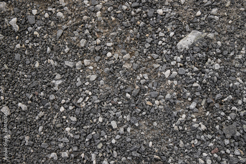 The texture of fine gray gravel made of small stones.