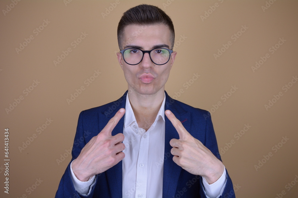 Ταπετσαρία Elegantly Overconfident Man Pointing at Himself with a Smirk on Isolated Backgro