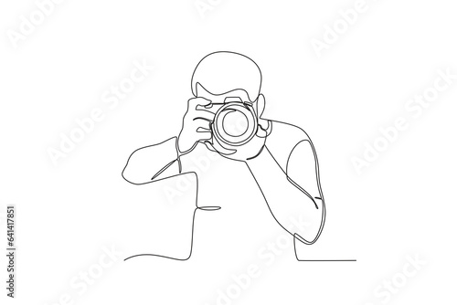 A photographer takes pictures. World photography day one-line drawing © stlineart